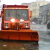 Snow plow in position on the corner of E. Houston and Ave A in Manhattan.